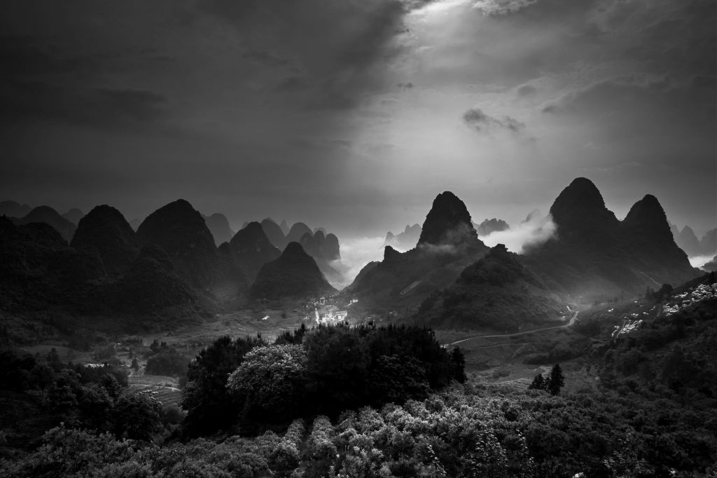 Yangshuo, situated in the Chinese province of Guanxi, and its surrounding area is primarily known for its karst mountains as well as the Li and Yulong River, which altogether create an absolute surreal landscape, and incredible views.