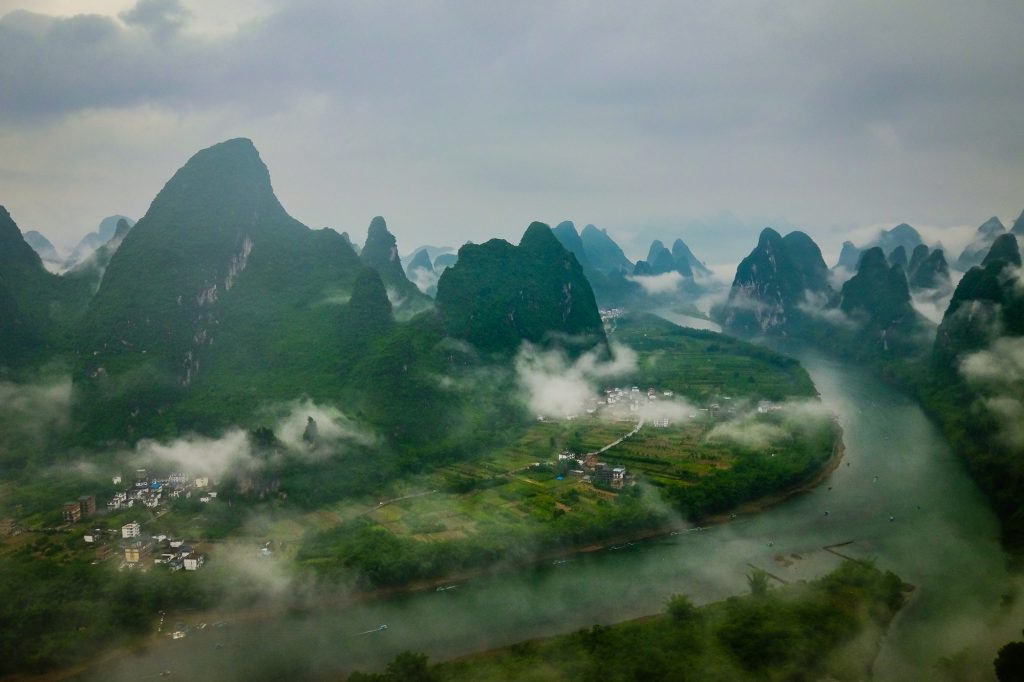 Yangshuo, situated in the Chinese province of Guanxi, and its surrounding area is primarily known for its karst mountains as well as the Li and Yulong River, which altogether create an absolute surreal landscape, and incredible views.