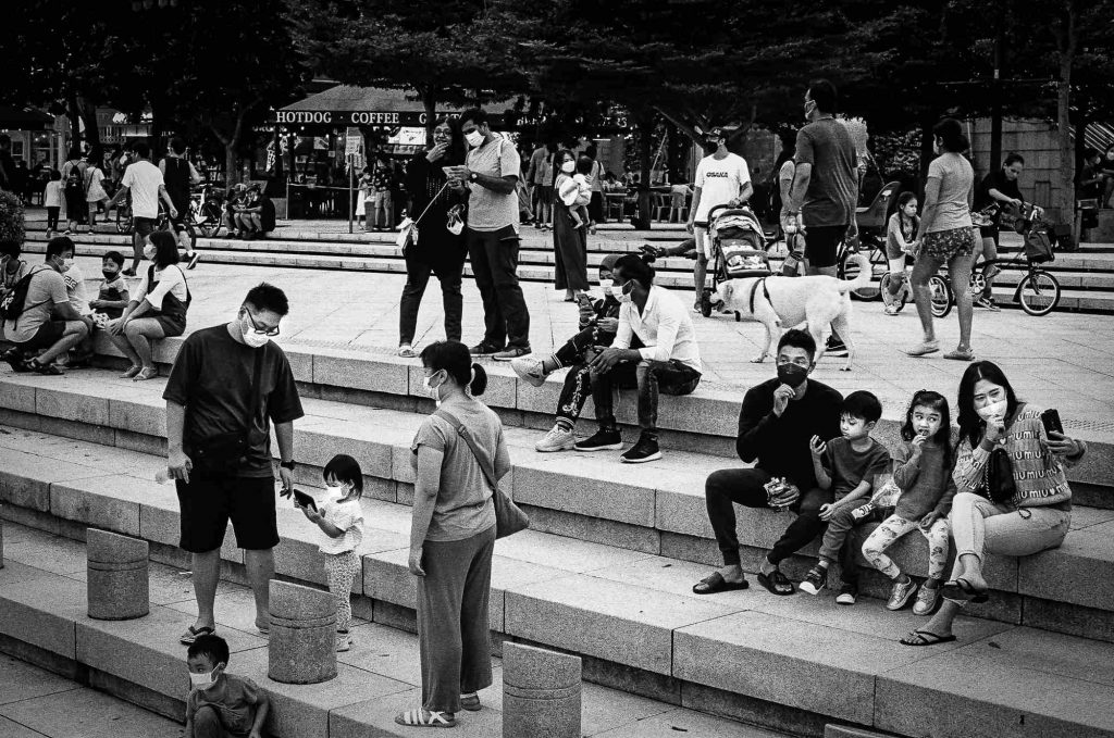 Couples and families are seen as they hang out in front of Merlion, Singapore