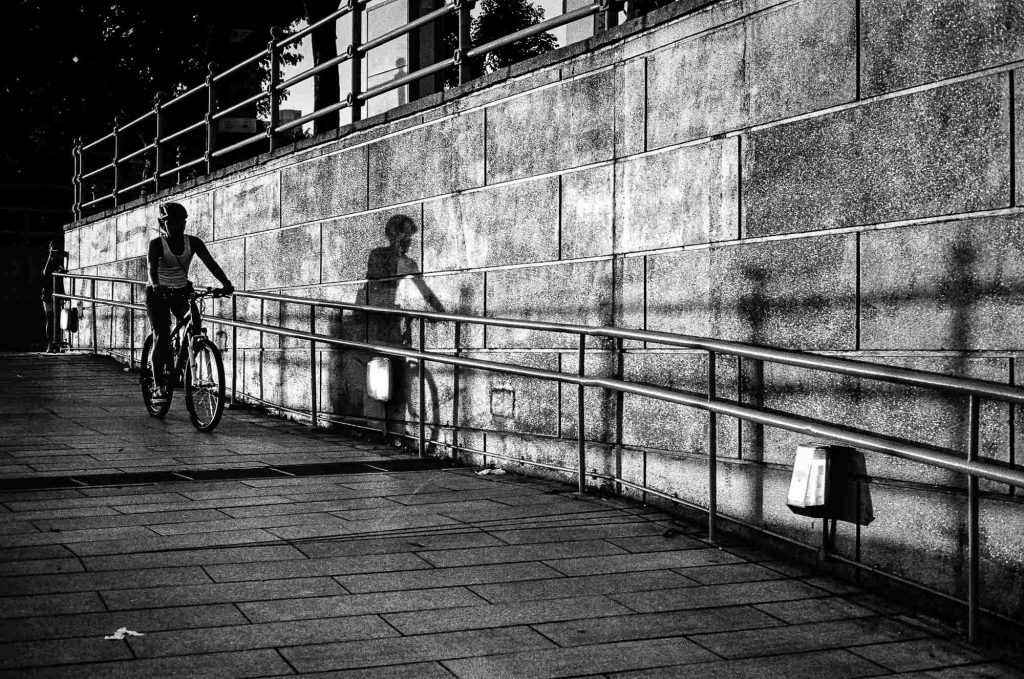 A cyclist is seen as she passes by.